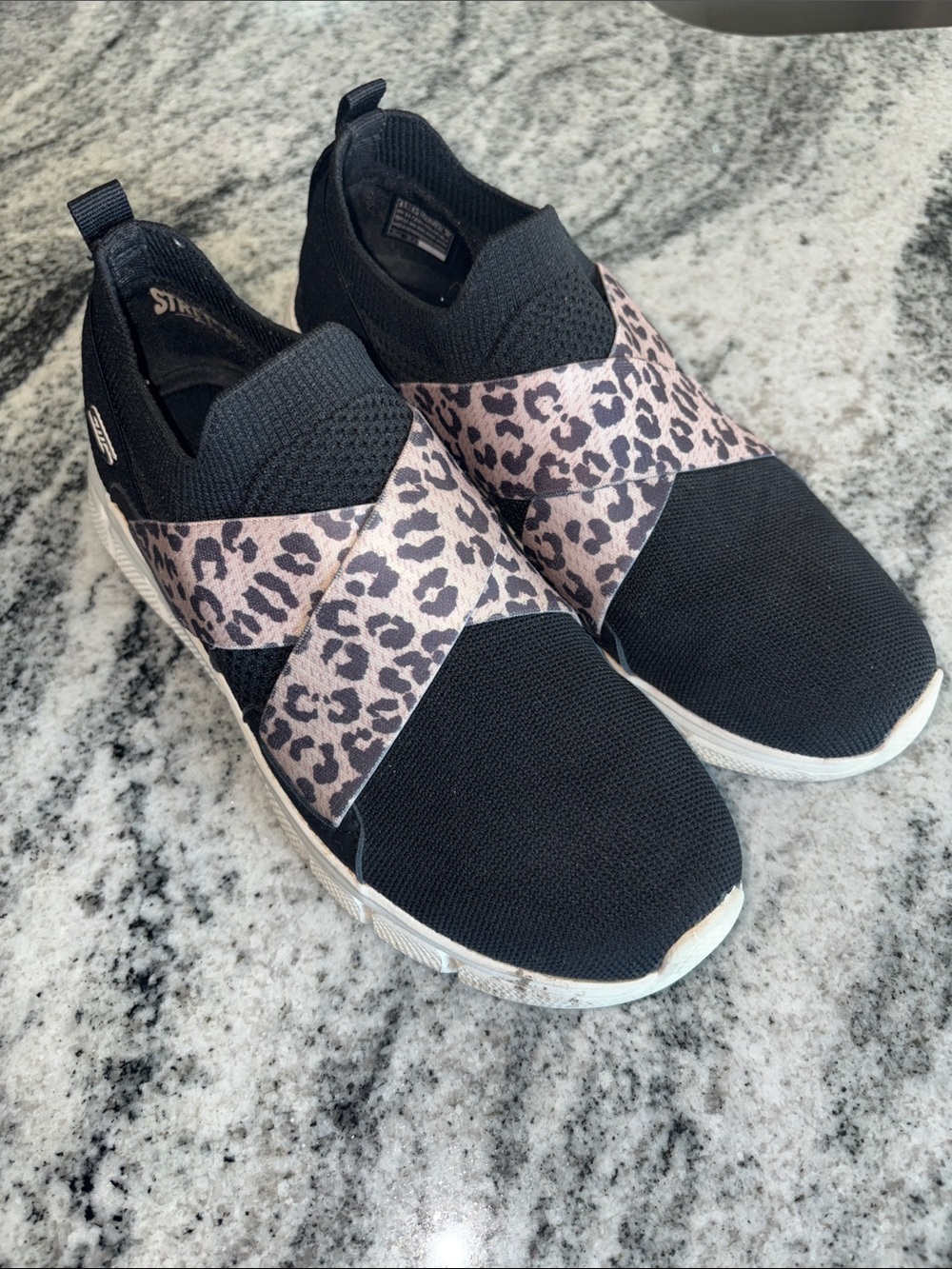 Skechers  Black Slip-On Sneakers with Leopard Cross Straps